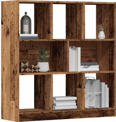 A wooden bookshelf with multiple compartments, some filled with books and decorative items.