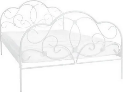A white metal bed frame with a mattress.