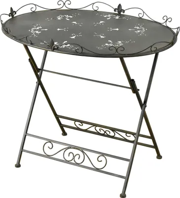 A dark gray oval folding table with decorative cutouts and patterns on the tabletop.