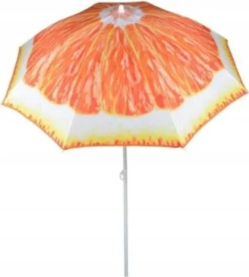 A beach umbrella with a grapefruit slice pattern.