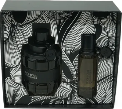 A gift set of Viktor & Rolf Spicebomb fragrances, featuring a large Eau de Toilette bottle and a smaller travel-sized bottle, presented in a black box with a striking black and white floral pattern.