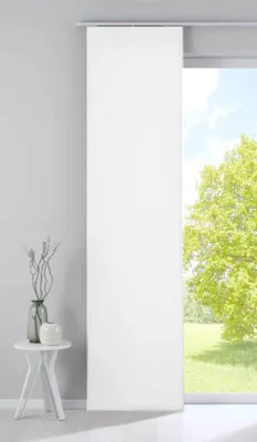 A white panel curtain hanging in front of a window with a view of trees and sky.