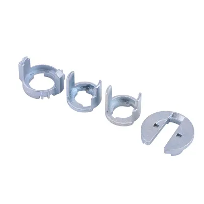 Four metal lock cylinder repair parts are arranged diagonally on a white background.