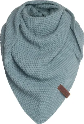 A knitted triangular scarf is displayed against a white background.