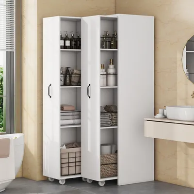 A white storage cabinet with multiple shelves filled with toiletries and towels, placed in a bathroom setting next to a sink and a window.