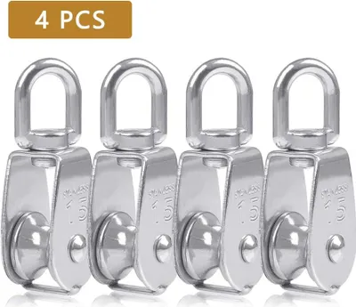 Four stainless steel pulleys are lined up against a white background.
