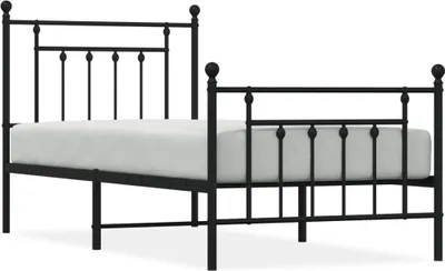 A black metal bed frame with a mattress.