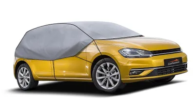 A yellow car covered with a gray car cover, shown from the front-left side against a white background.