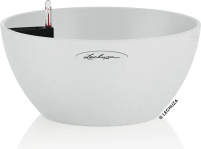 A white planter with a textured surface and a water level indicator.
