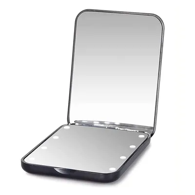 A black compact mirror with lights is open, showing its reflective surface and the lights around the edge.