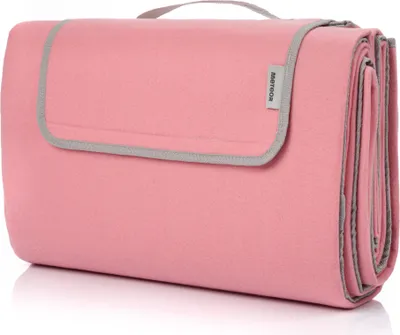 A folded pink picnic blanket with gray trim and a handle, presented on a white background.
