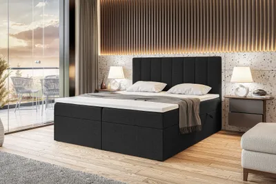 A bedroom scene with a bed, nightstands, and a balcony view.