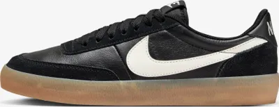 A side view of a black Nike Killshot 2 sneaker with a white swoosh and a gum sole.
