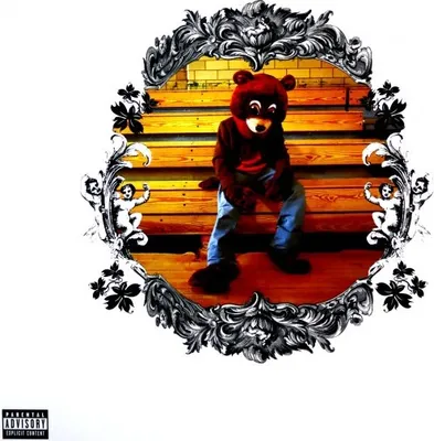 A bear mascot sitting on bleachers, framed by an ornate border.