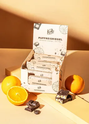 Produktbild von KoRo I Puffreisriegel in Zartbitterschokolade mit Orange 20 x 18 g