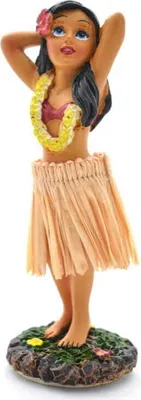 A figurine of a hula dancer on a decorative base.