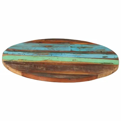 A round tabletop made of reclaimed wood with horizontal planks of varying colors.