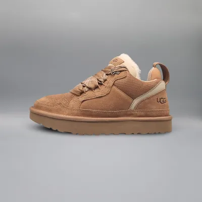 A single UGG shoe is shown against a plain gray background.