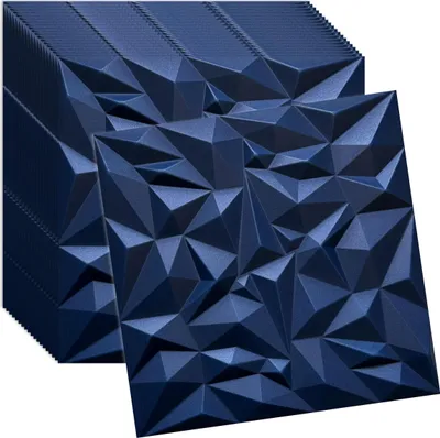 A stack of navy blue 3D wall panels with a geometric, faceted design, with one panel placed in front of the stack.