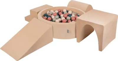 A soft play area for children with a ball pit and various foam shapes.