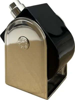 A close-up, angled shot of a perfume bottle.