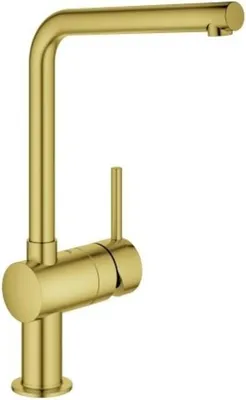 A studio shot of a gold kitchen faucet against a white background.