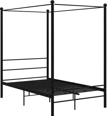 A black metal canopy bed frame.