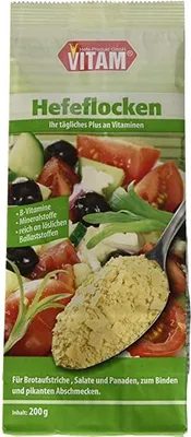 A package of nutritional yeast flakes with a salad depicted on the front.