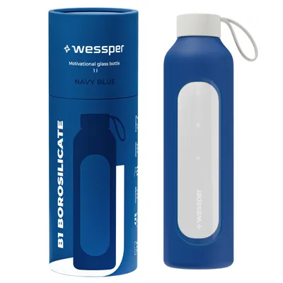 A navy blue glass water bottle with a white lid and a white silicone sleeve, shown next to its cylindrical navy blue packaging.