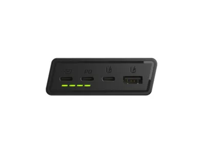 A black power bank with ports and indicator lights is shown against a white background.
