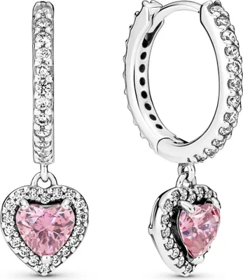 A pair of sterling silver hoop earrings with pink heart-shaped pendants, each adorned with small clear stones.
