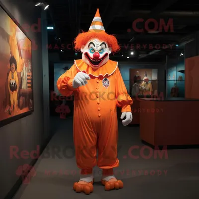Obrázok produktu pre Maskot spoločnosti REDBROKOLY, oranžový zlomyselní klaun, oblečený v overale a čiapke