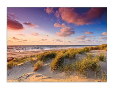 Produktbild von Wallario Herdabdeckplatte aus Glas, Größe 70 x 52 cm 2-teilig, Motiv Abendspaziergang am Strand - Sonnenuntergang über dem Meer