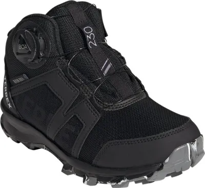 A black Adidas Terrex Boa Mid youth sports shoe.