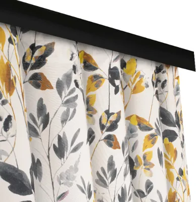 A close-up view of a curtain with a floral pattern.