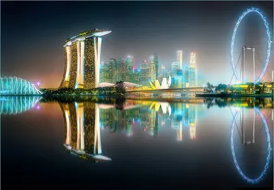 Produktbild von Wallario Fototapete Vliestapete, seidenmatte Oberfläche, einfache Verarbeitung, Größe 300 x 210 cm, Motiv Singapur bei Nacht