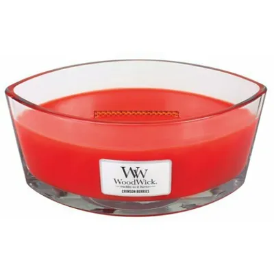A red WoodWick candle in a clear glass container.