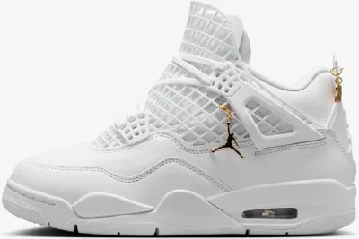A white Nike Air Jordan 4 sneaker with gold accents.