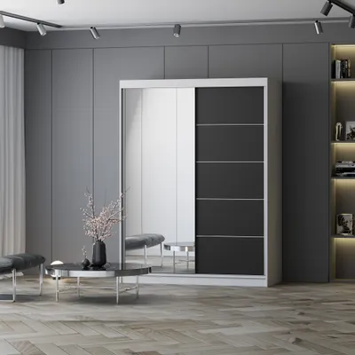 A modern bedroom or living room setting with a large sliding door wardrobe, a coffee table, and seating.