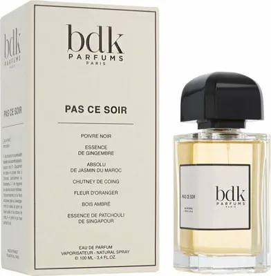 A bottle of BDK Parfums Pas Ce Soir EDP and its packaging are displayed side-by-side on a white background.