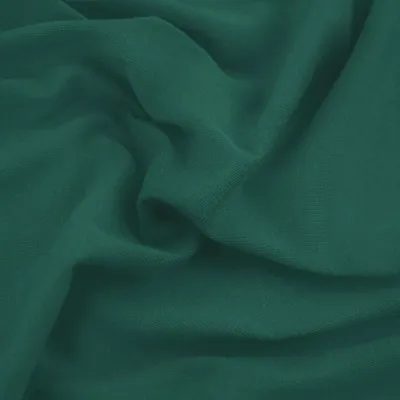 A close-up view of draped teal fabric.