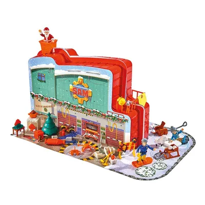 A Christmas-themed advent calendar shaped like a fire station, with Santa on top and various figures and accessories around it.
