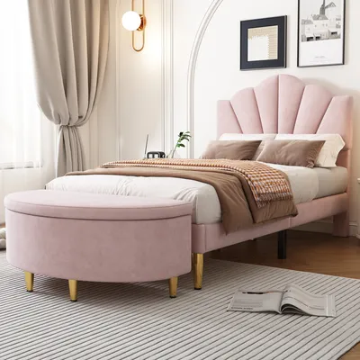 A bedroom scene featuring a pink upholstered bed and a matching storage bench.