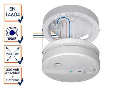 A smoke detector shown with its mounting plate and wiring connections, along with feature callouts.