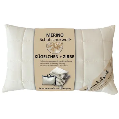 A white quilted pillow with a product label attached.