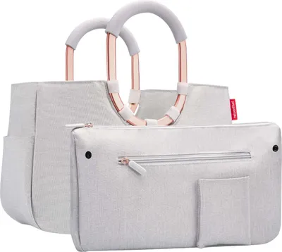 A light gray tote bag with rose gold handles and a matching pouch.
