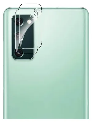 A close-up of the back of a green smartphone showing a camera lens protector being applied.