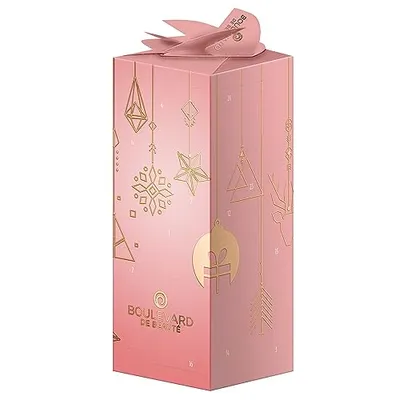 A pink advent calendar with gold Christmas-themed decorations.