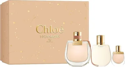 A gift set of Chloe Nomade Eau de Parfum miniatures and a box.
