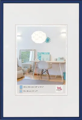 A framed picture with an interior scene displayed within the frame.